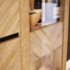 NIKOMEDES Display Cabinet in Spica Oak, Matt Black & Bartex Oak - Image 5
